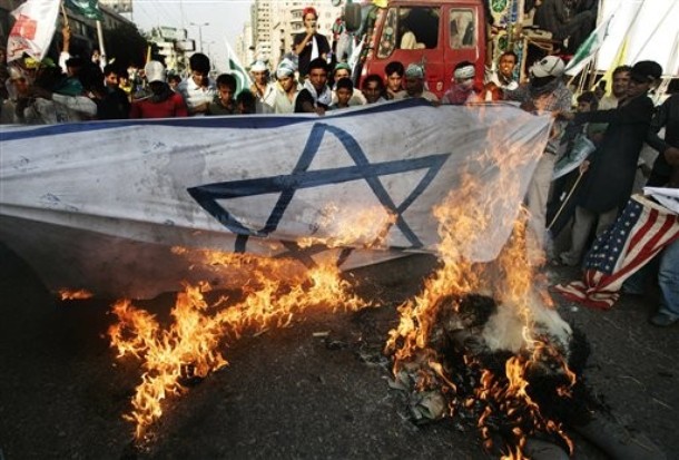 Pakistanis burn an Israeli flag during a rally to mark Quds day in Karachi, Pakistan, Friday, Sept. 18, 2009. Thousands of people marched in Karachi Friday to mark Quds Day an annual anti-Israel commemoration that reflects Pakistan's sympathy with the Palestinians. (AP Photo/Shakil Adil)